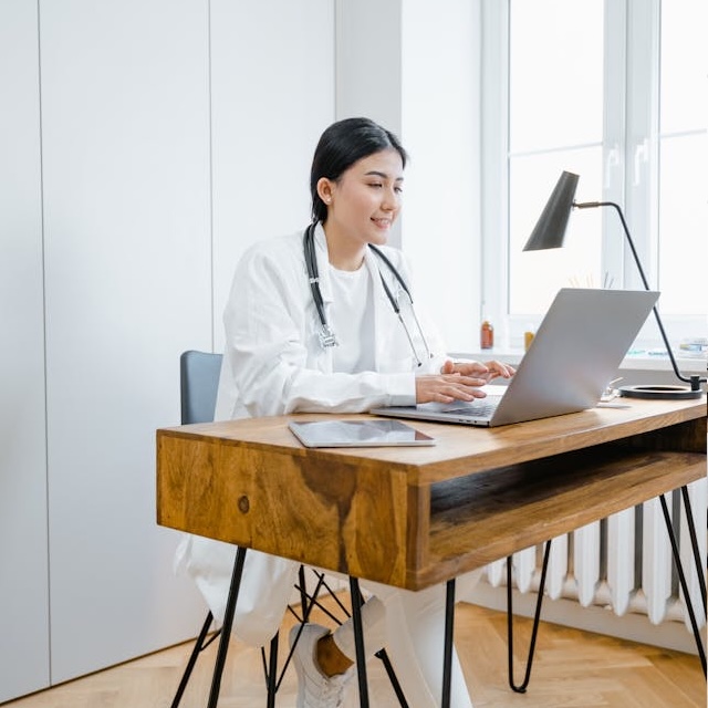 Healthcare professional using digital prescription software on tablet - Formidable Care e-prescription platform